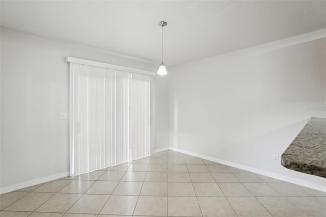 unfurnished dining area featuring light tile patterned flooring