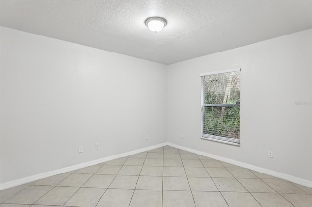 empty room with a textured ceiling