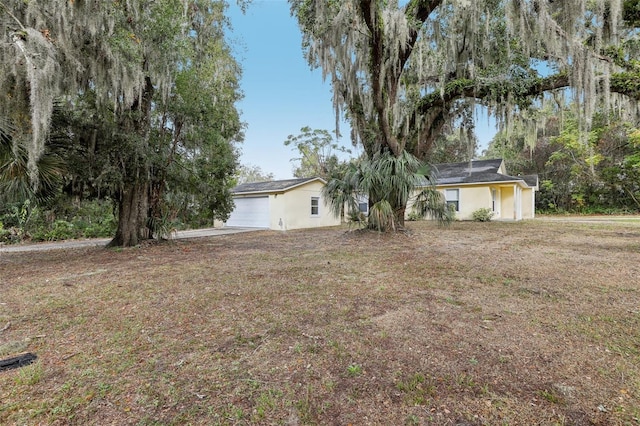 view of yard featuring a garage