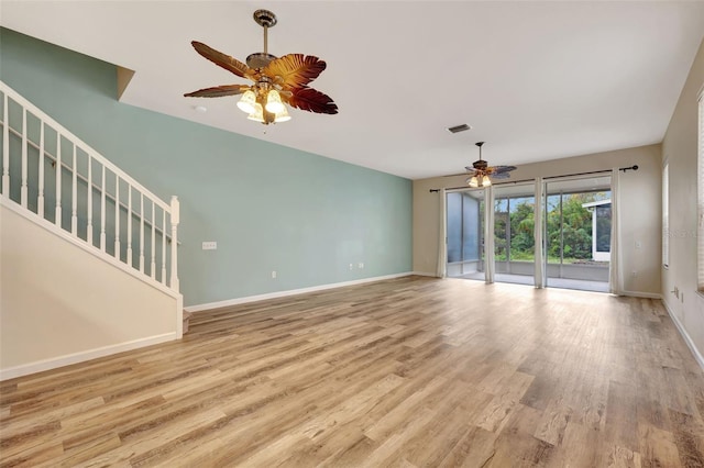 unfurnished living room with ceiling fan and light hardwood / wood-style flooring