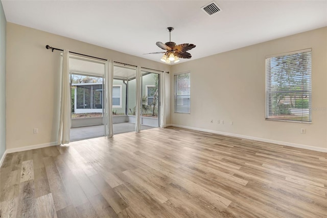 unfurnished room with ceiling fan and light hardwood / wood-style floors