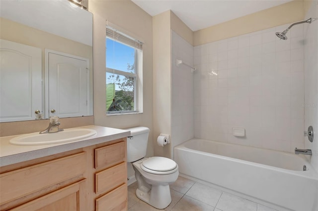 full bathroom featuring tiled shower / bath combo, toilet, tile patterned flooring, and vanity