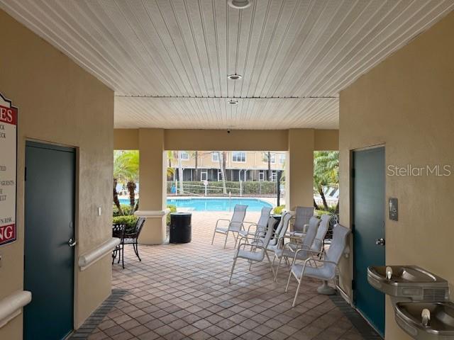 view of patio featuring a community pool