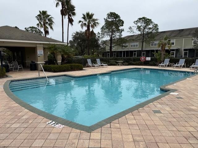 view of swimming pool featuring a patio area