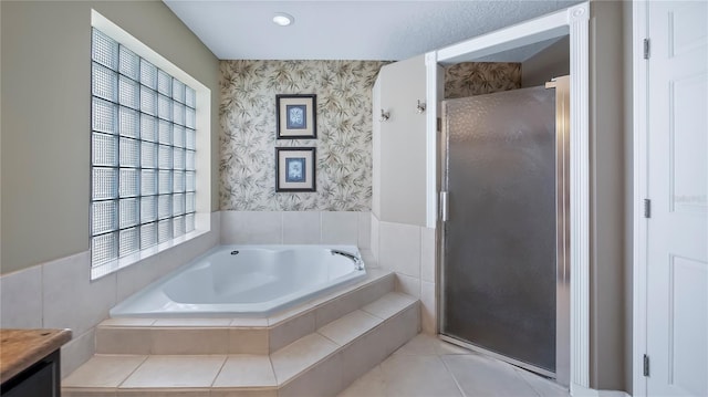 bathroom featuring vanity, tile patterned floors, and shower with separate bathtub