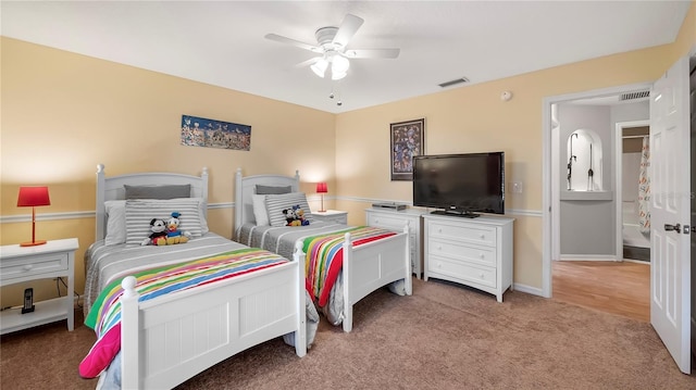 bedroom with ceiling fan and light colored carpet