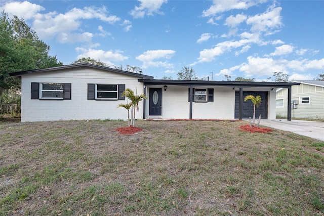 ranch-style home with a carport and a front yard