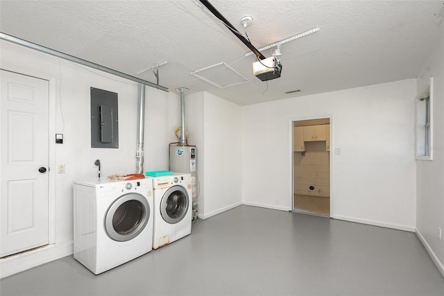 washroom featuring water heater, electric panel, washing machine and dryer, and a textured ceiling