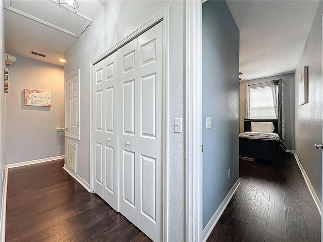 corridor with dark wood-type flooring