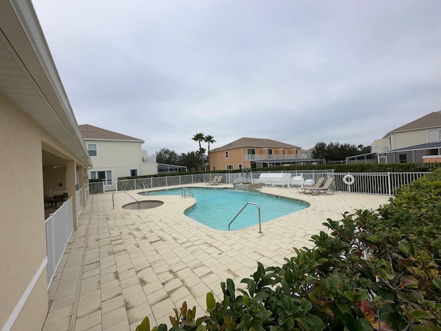 view of swimming pool with a patio