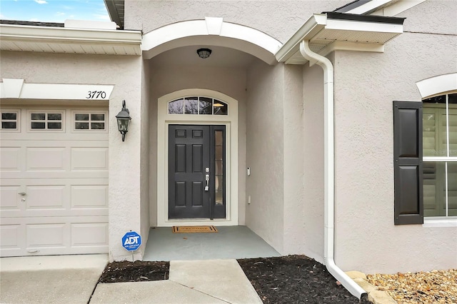 property entrance featuring a garage