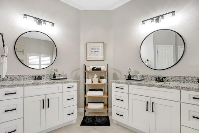 bathroom with tile patterned floors and vanity