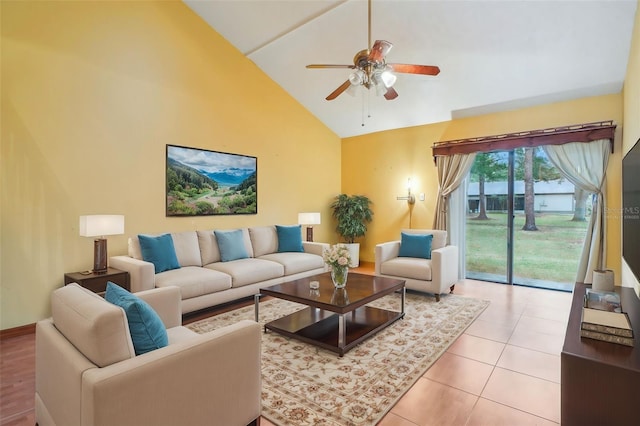 living area featuring high vaulted ceiling, a ceiling fan, and tile patterned floors