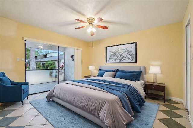 bedroom with ceiling fan and baseboards