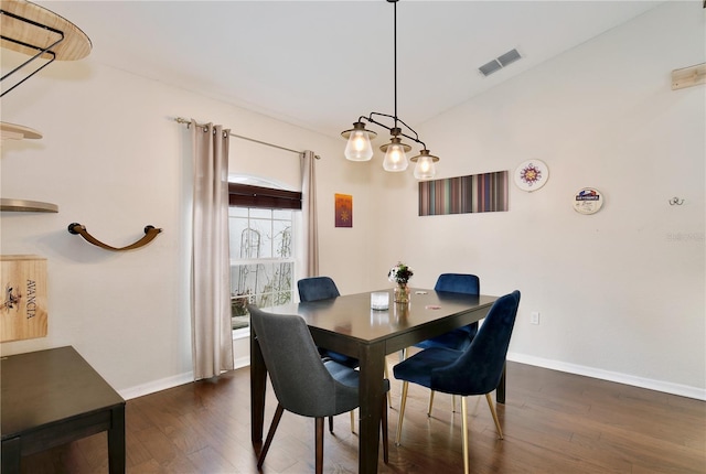 dining area featuring dark hardwood / wood-style flooring