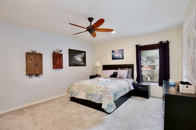 bedroom with ceiling fan and carpet flooring