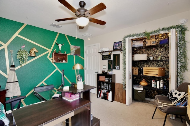 carpeted office featuring ceiling fan