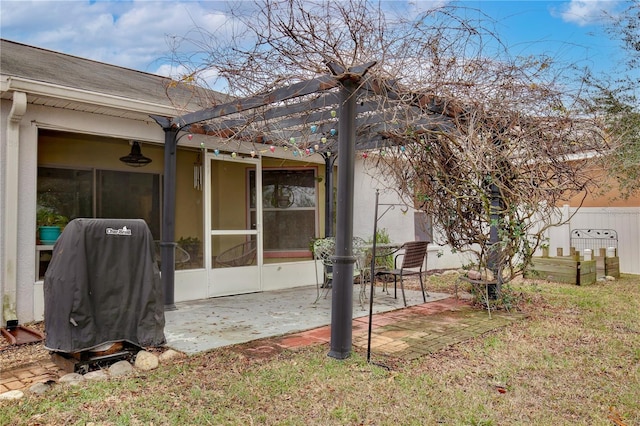 exterior space featuring a sunroom, a lawn, and a patio area