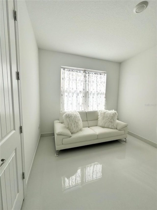 living room with a textured ceiling