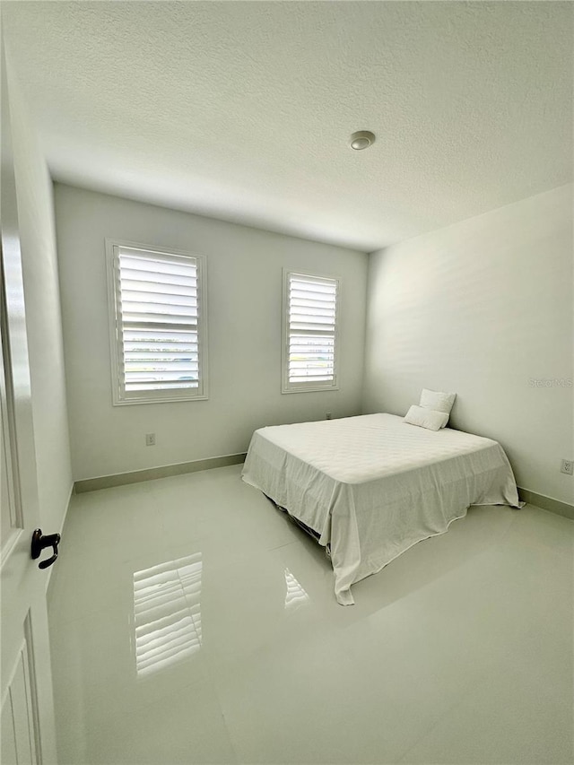 bedroom with a textured ceiling