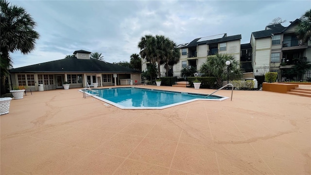 view of swimming pool featuring a patio area