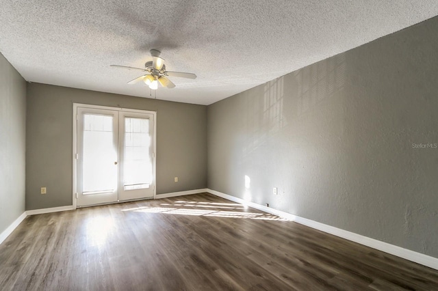 spare room with ceiling fan, hardwood / wood-style floors, a textured ceiling, and french doors