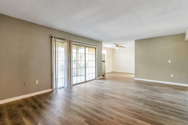 spare room featuring ceiling fan and wood-type flooring