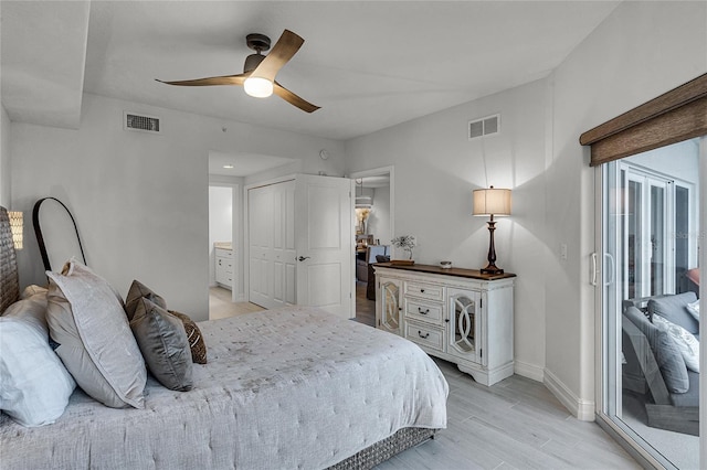 bedroom with access to exterior, light wood-style floors, visible vents, and baseboards