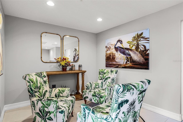 sitting room with recessed lighting and baseboards