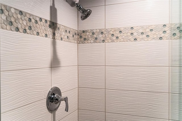 details with a tile shower