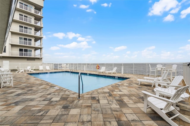 pool featuring a patio area