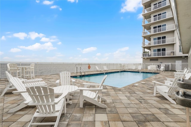 community pool with a patio