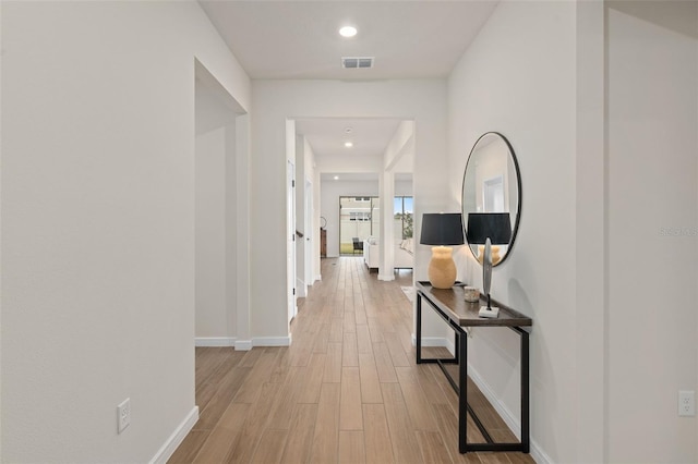 corridor featuring light hardwood / wood-style flooring