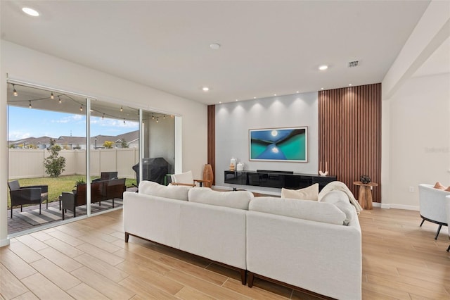 living room with light hardwood / wood-style floors