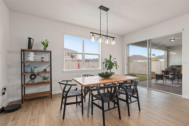 dining area featuring a healthy amount of sunlight and light wood-type flooring