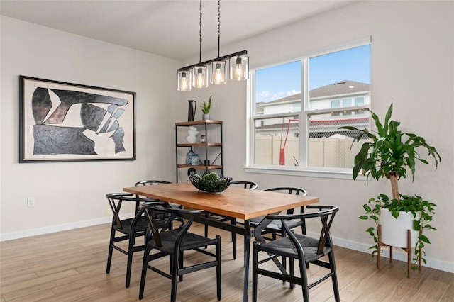 dining space featuring light hardwood / wood-style flooring