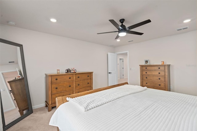 bedroom with ceiling fan and light colored carpet