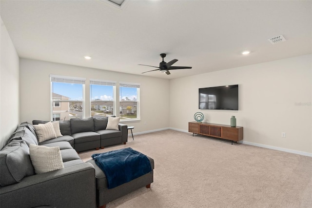 living room featuring light carpet and ceiling fan