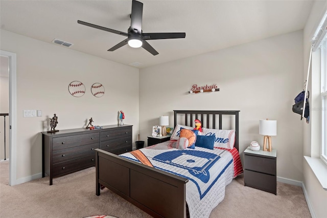 bedroom featuring light carpet and ceiling fan