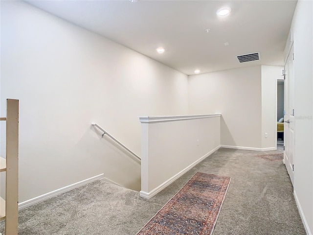 hallway with carpet floors