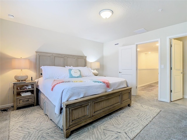 bedroom with light carpet