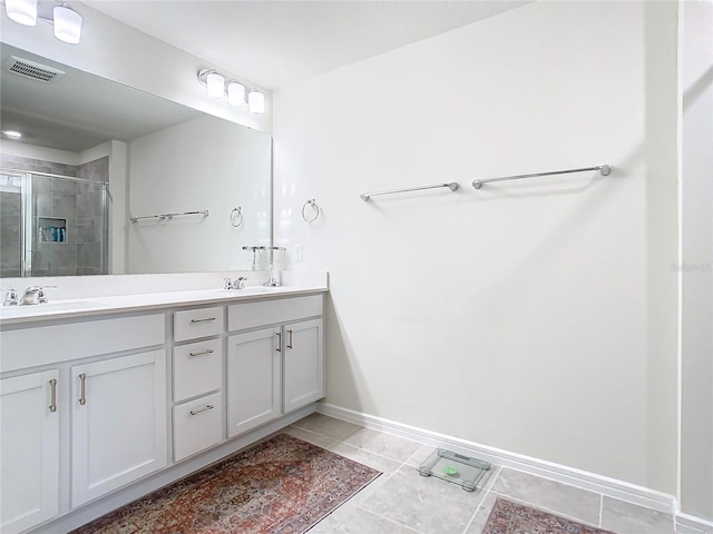 bathroom with vanity, tile patterned floors, and walk in shower