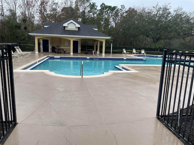 view of swimming pool with a patio area