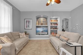 living room featuring ceiling fan