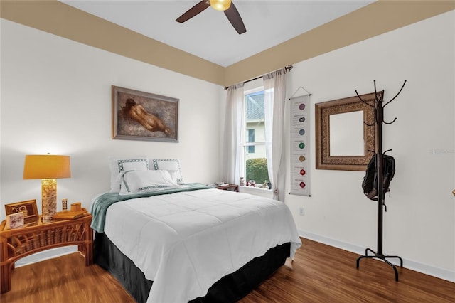 bedroom with hardwood / wood-style floors and ceiling fan