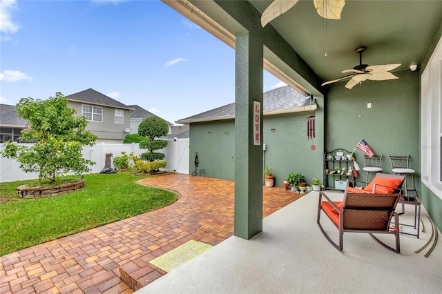 view of patio / terrace featuring ceiling fan