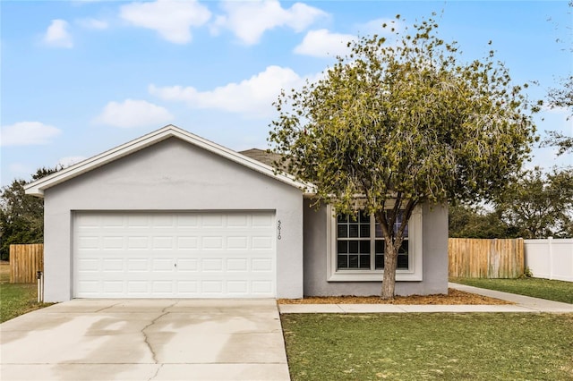 view of front facade with a garage and a front yard