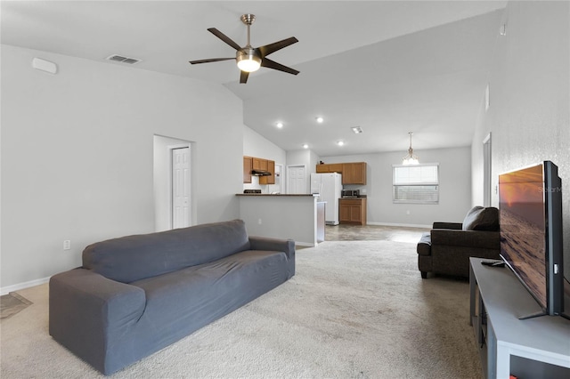 carpeted living room with lofted ceiling and ceiling fan