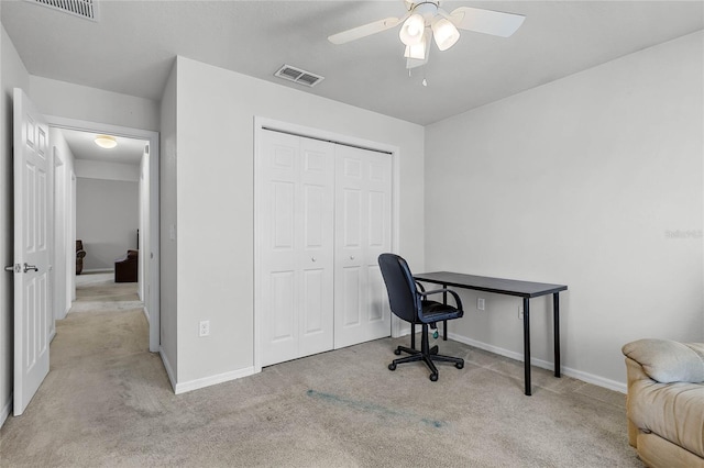 home office with light colored carpet and ceiling fan