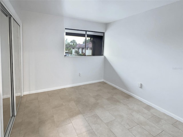 unfurnished bedroom featuring a closet